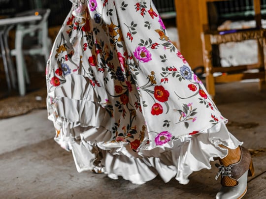 White dress with ruffles and bright flowers