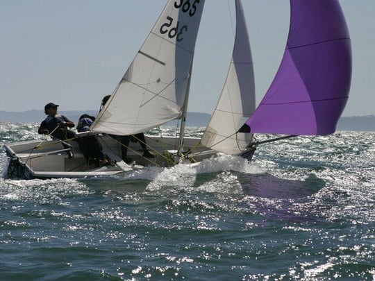 Sailboat with people on the water