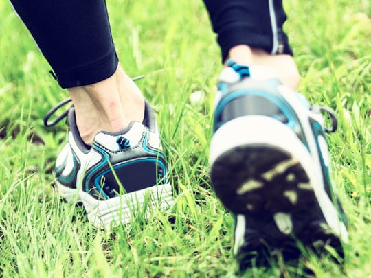 White, black and blue running shoes