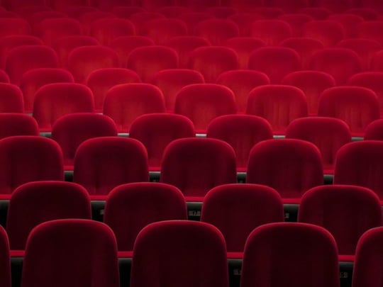 Empty red seats in a theatre