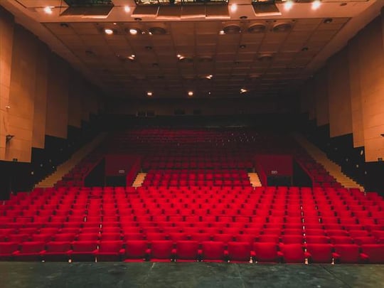Empty red seats in a theatre
