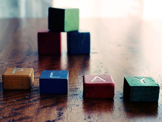 Colourful children's blocks spelling the world play