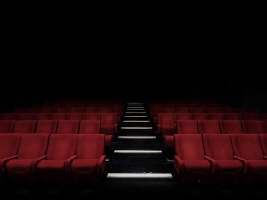 Empty red seats in a theatre