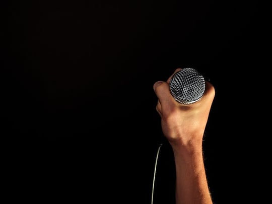 Hand holding a microphone