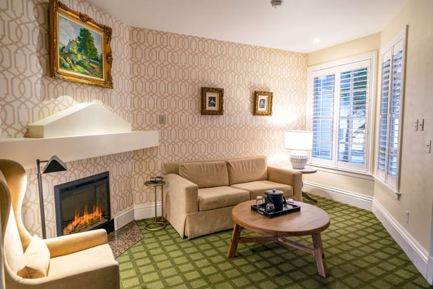 Queen with Living Area, Sofabed, Fireplace, and Patio