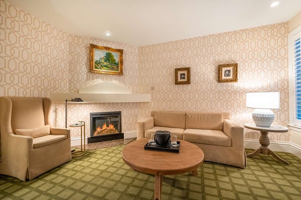 Queen with Living Area, Sofabed, Fireplace, and Patio