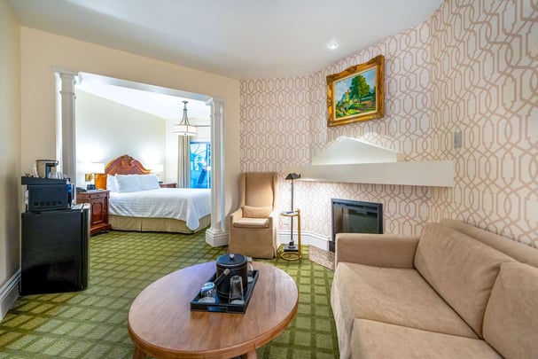 Queen with Living Area, Sofabed, Fireplace, and Patio