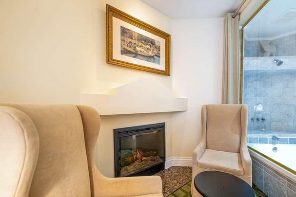 Single Queen Guest Room with Sofabed and Sitting Area, Fireplace, and Patio