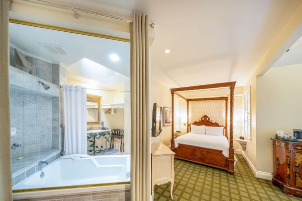 Single Queen Guest Room with Sofabed and Sitting Area, Fireplace, and Patio