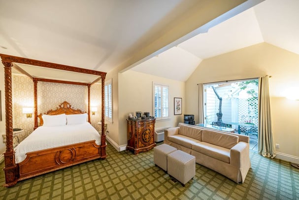 Single Queen Guest Room with Sofabed and Sitting Area, Fireplace, and Patio