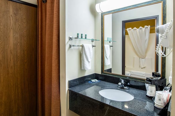 Vanity sink outside guest bathroom