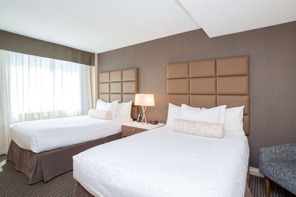 Suite Two Double Beds- Perfect for guests traveling with a family or large group, this suite offers exceptional space with separate living room area and upgraded in-room features