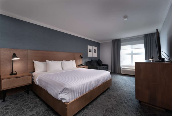 Two Queen and One King Bed in Kitchenette Suite