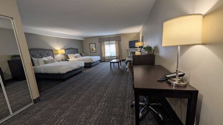 Queen Beds Sofa and Fireplace