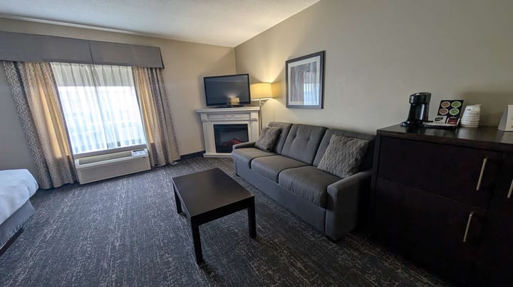 Queen Beds Sofa and Fireplace