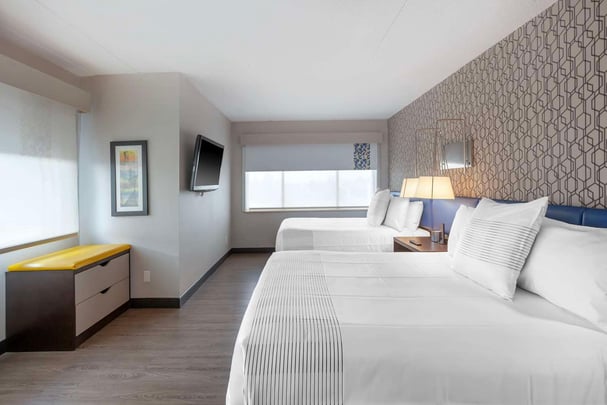 Two Queen Bed Family Suite Guest Room with separate bedroom