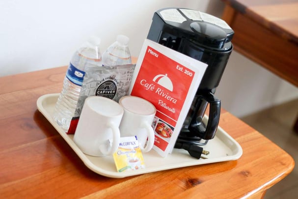 coffee maker and supplies in room