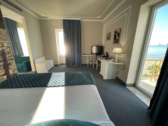 Junior Suite with 1 King 2 Single Beds and Balcony Sea View