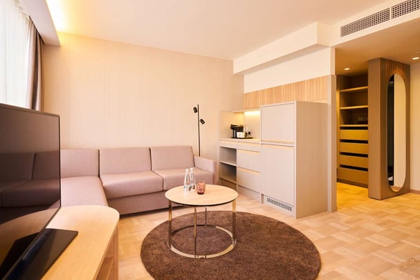 Deluxe Family kitchenette and couch