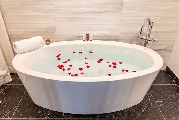 Best Western Plus Crystal Hotel and Spa Prestige Suite Bathtub and Rose Petals