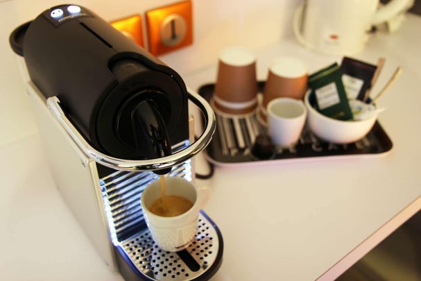 Nespresso machine and courtesy tray