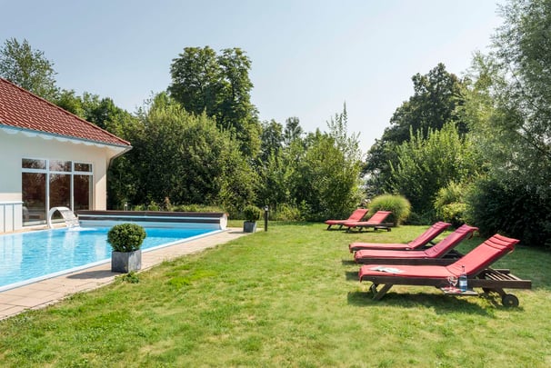 sunbathing area with pool