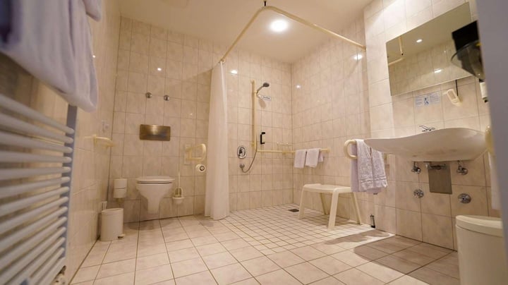 Family suite bathroom wheelchair accessible