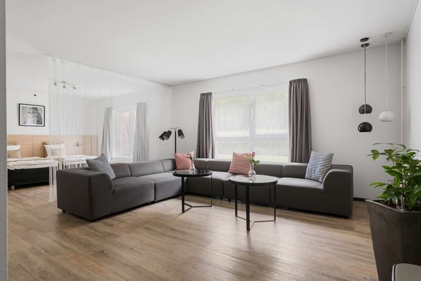 Family plus living room with bed