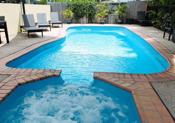 Outdoor pool with spa