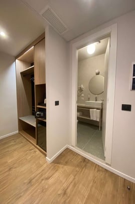 Guest Room with One Queen Size Bed Entry to Bathroom