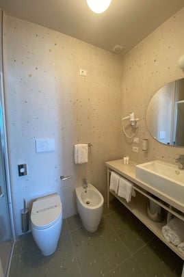 Bathroom in Guest Room with One Queen Size Bed