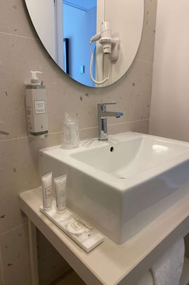 Bathroom in Guest Room with One Queen Size Bed