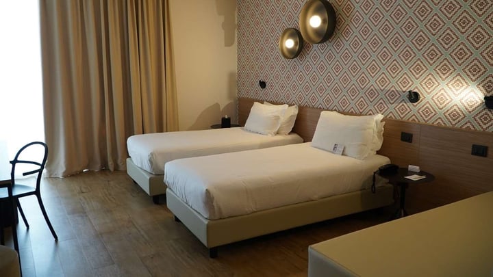 One Queen Bed Converted to Two Twin Beds and One Other Twin Bed