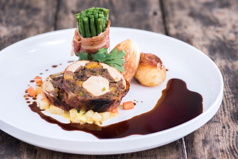 Pistachio, apricot and prune stuffed poussins