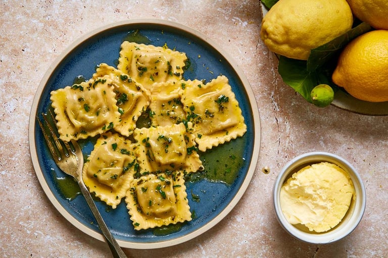 Crab, lemon and clotted cream ravioli with herb butter