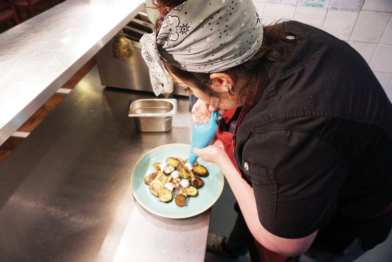 Ayesha cooking at Queen of Cups, Glastonbury