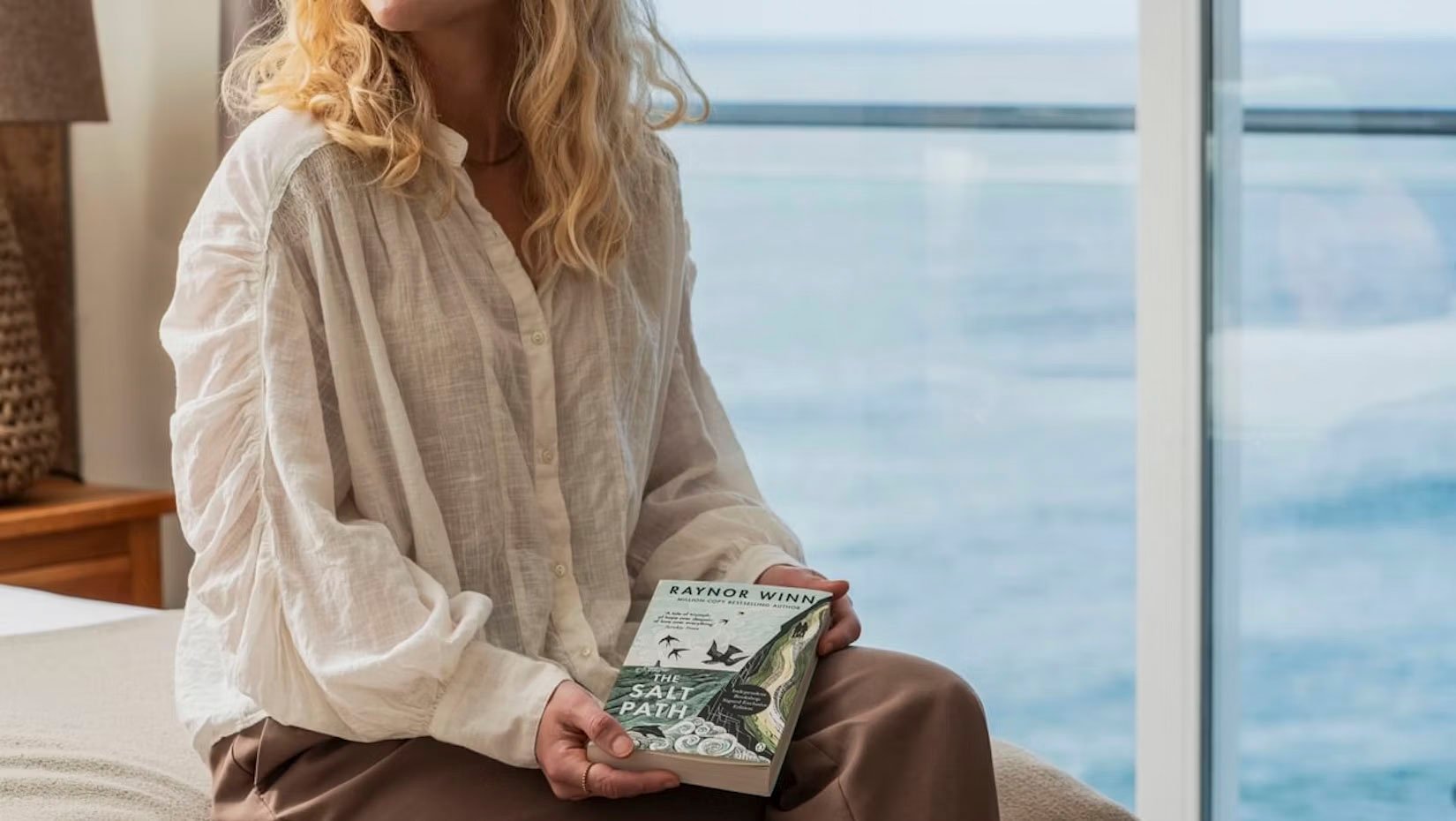 woman holding salt path book