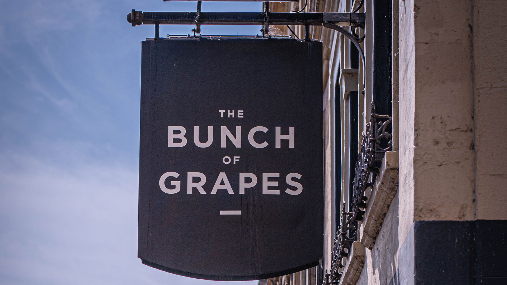The Bunch of Grapes outdoor sign, a cosy pub for a festive gathering