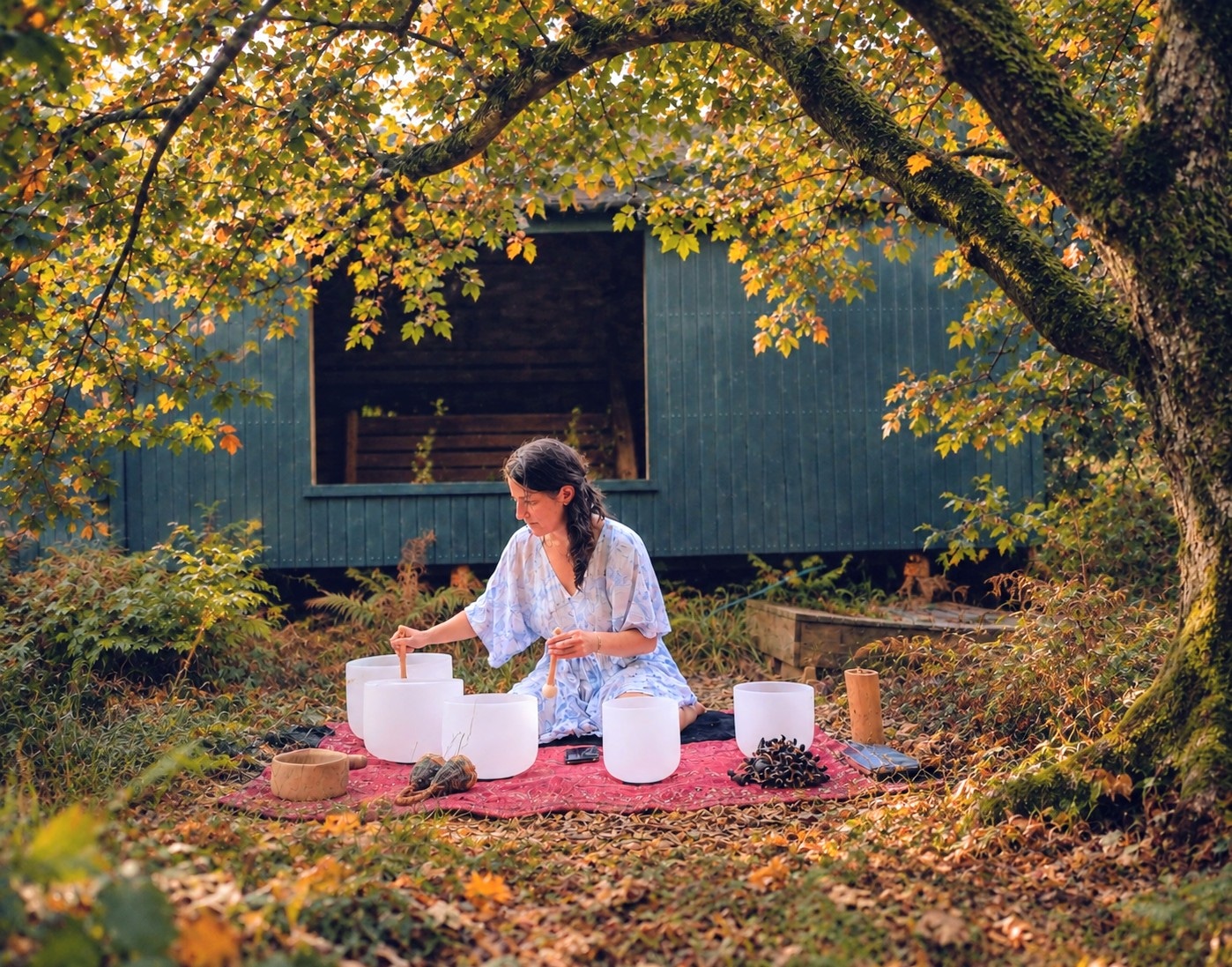 lady playing crystal bowls