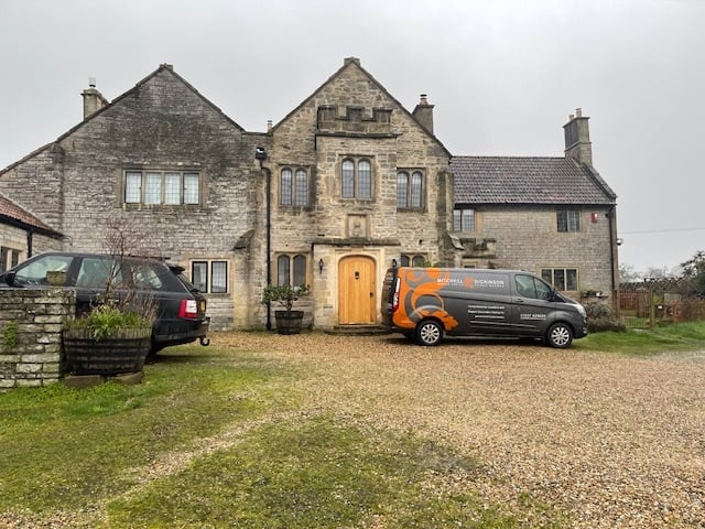 Mitchell and Dickinson vans outside a stunning period property