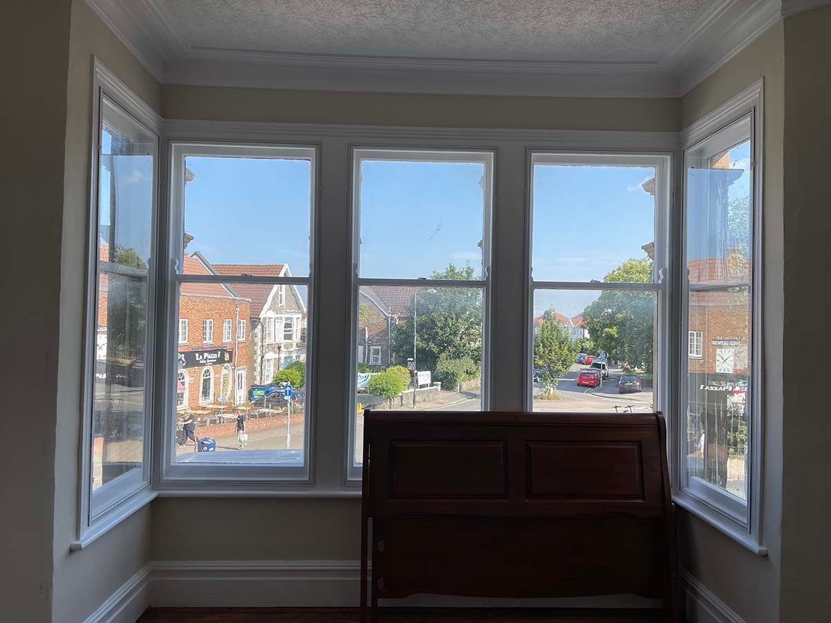 Interior view of sash window with secondary glazing fitted behind original sashes