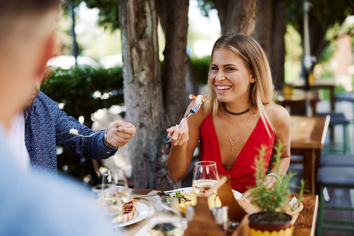 woman eating outdoors