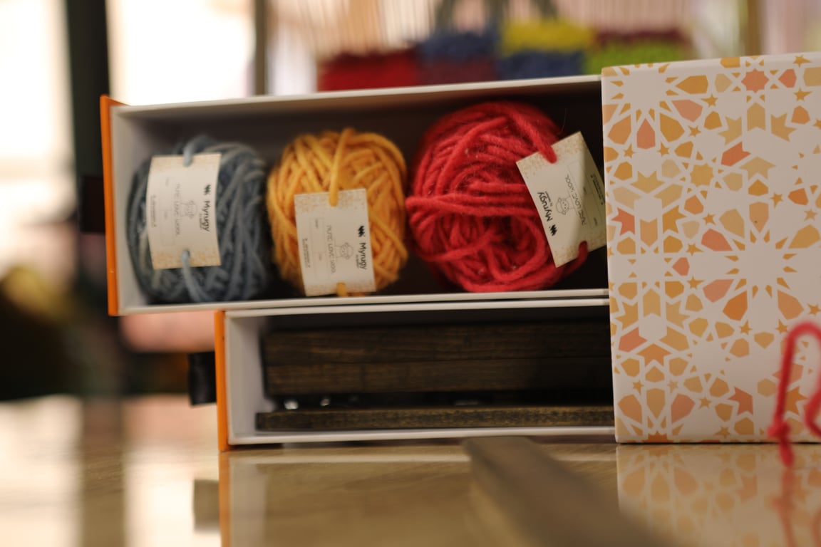 Open MyRugy Box showing organized, high-quality rug-making materials.