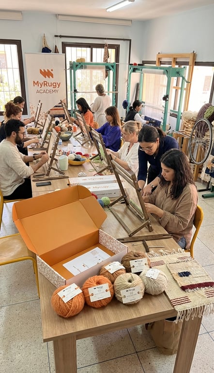 MyRugy Academy workshop: students learning fiber arts techniques.