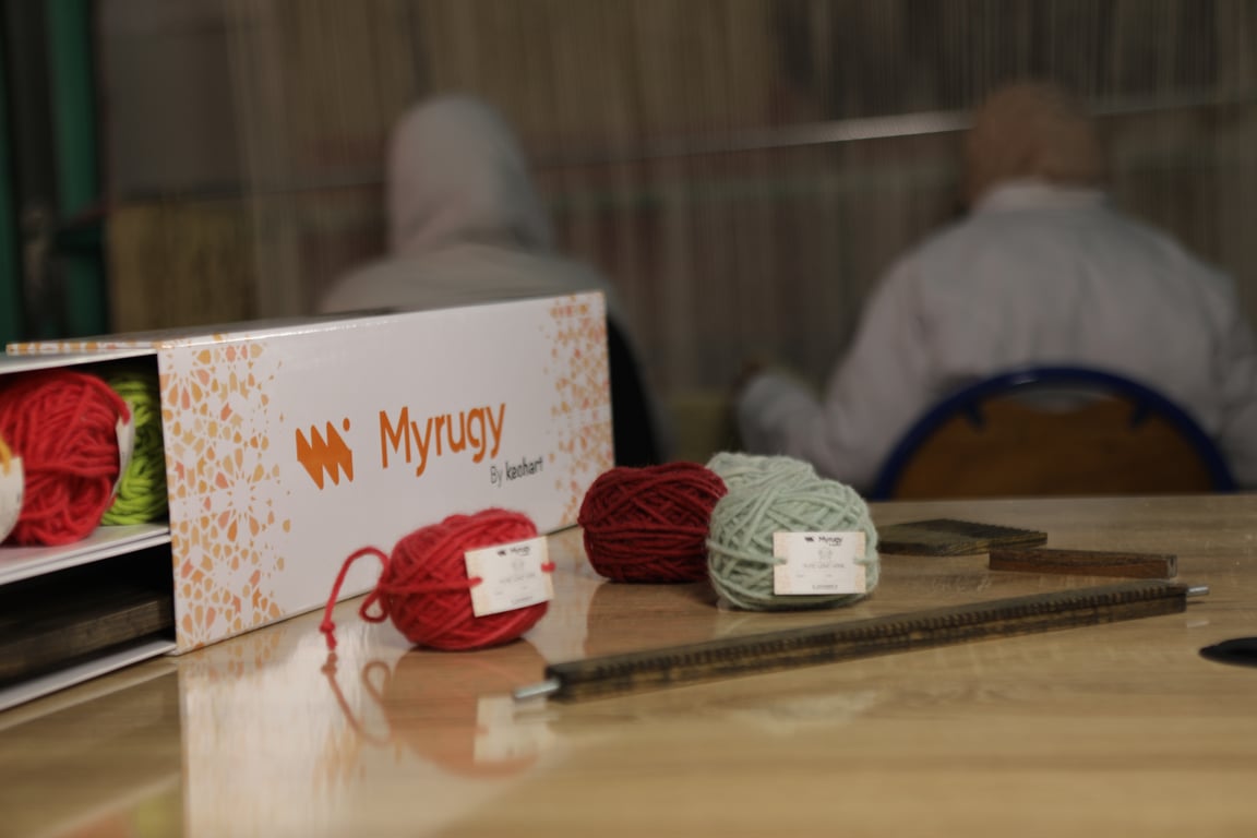 MyRugy Box contents: yarn, backing cloth, tools, and adhesives.