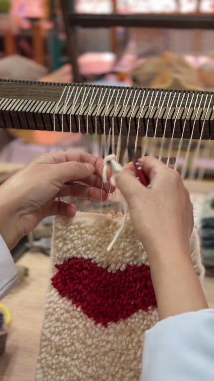 Couple weaving rugs together at myrugy workshop in Marrakech