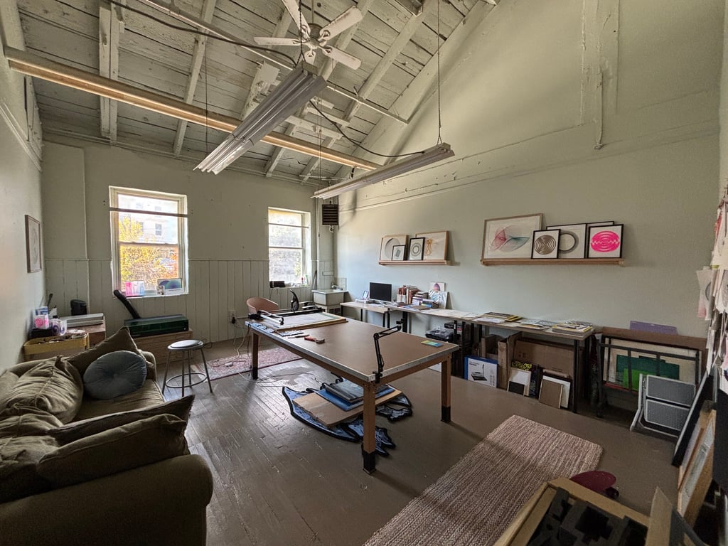 Studio workspace with art materials and works in progress