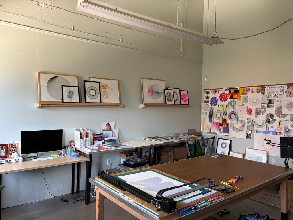 Additional studio view showing wall display of works