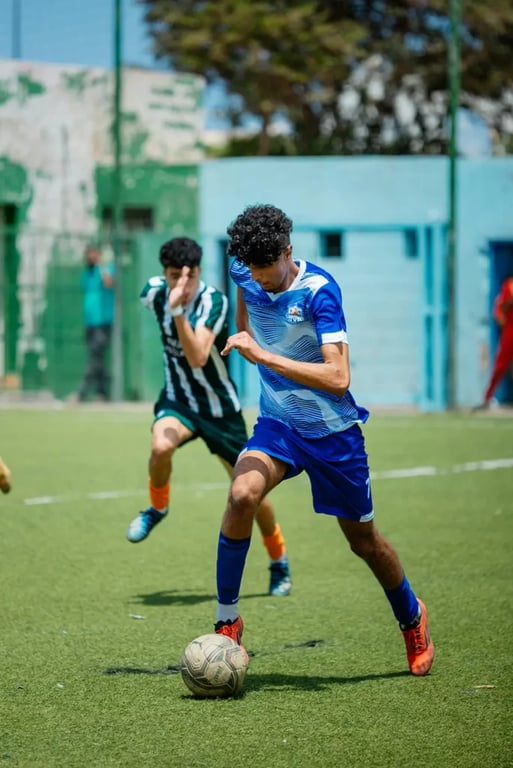 Man in Blue Soccer Kit playing football