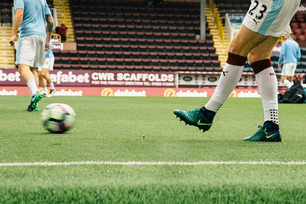 Soccer Player Kicking a Ball
